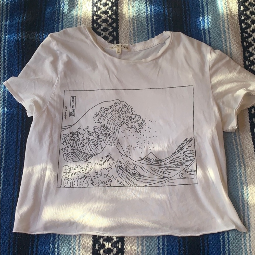 White Tee with “The Great Wave” printed on it.